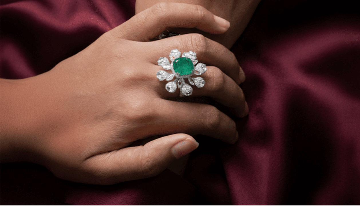 A statement ring worn on a hand